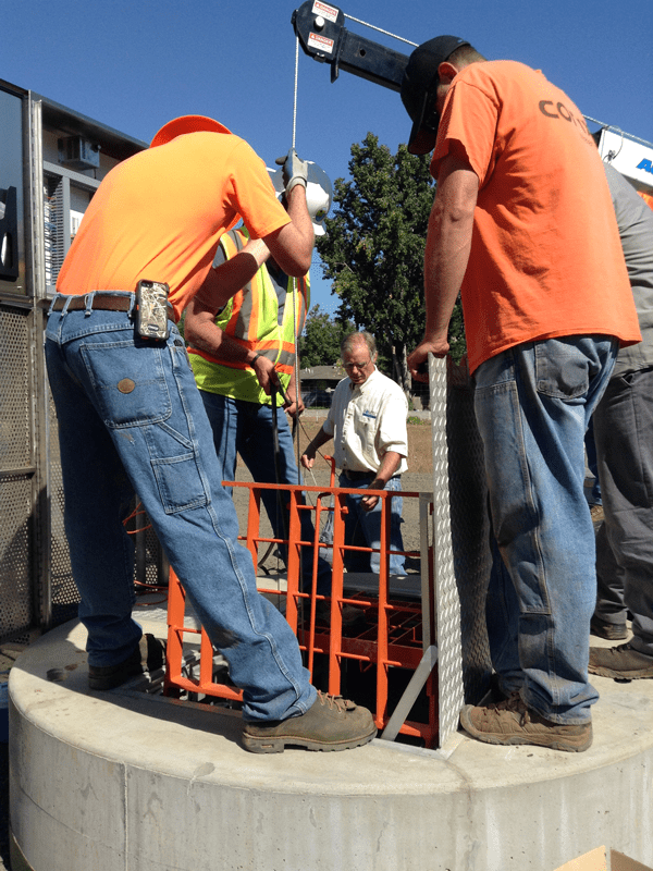 construction-advisor-for-pump-station-installers Contractors Installing Pumps in Pump Station