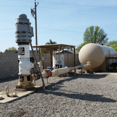 above-grade-pumping-system-with-bypass Water Pressure Boosting System in Urban Neighborhood