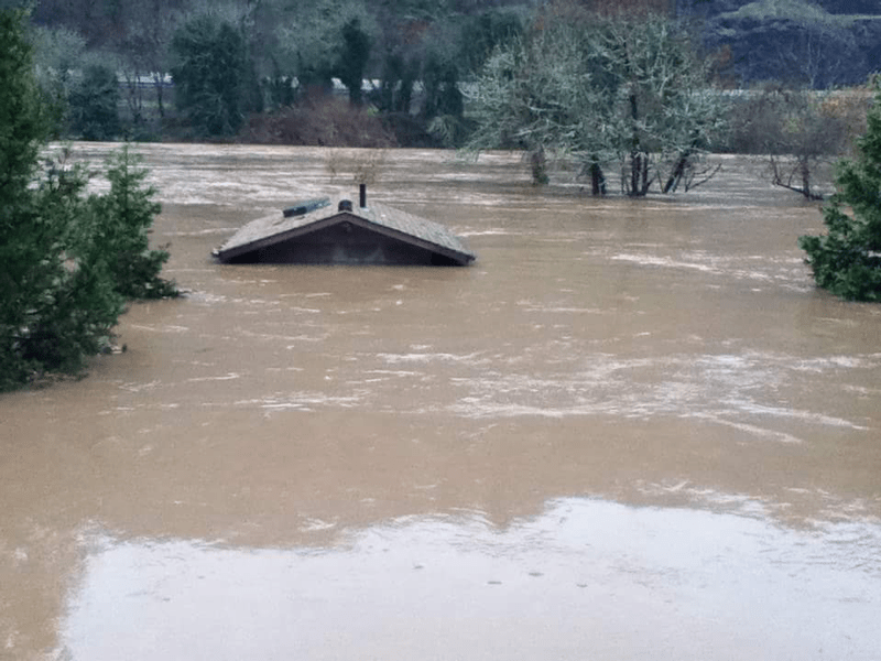 Restroom Building Nearly Submerged Beneath the Water