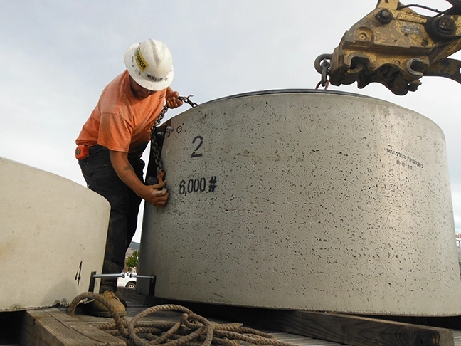 Precast Segment of Wet Well Being Prepared to Lift Up